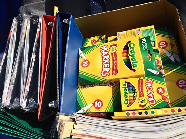 Close up photo of crayon boxes and binders Close up photo of crayon boxes and binders